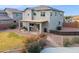 Two-story home with covered patio and grassy backyard at 2924 N Taylor Ln, Casa Grande, AZ 85122
