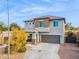 Two-story house with stone accents and a two-car garage at 2924 N Taylor Ln, Casa Grande, AZ 85122