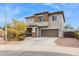 Two-story house with stone accents and welcoming front yard at 2924 N Taylor Ln, Casa Grande, AZ 85122