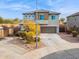 Two-story house with a stone facade and two-car garage at 2924 N Taylor Ln, Casa Grande, AZ 85122