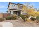 Two-story house with stone accents and landscaped yard at 2924 N Taylor Ln, Casa Grande, AZ 85122