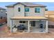 Covered patio with seating area and grill, adjacent to house at 2924 N Taylor Ln, Casa Grande, AZ 85122