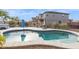 Relaxing kidney-shaped pool with spa and patio furniture at 2924 N Taylor Ln, Casa Grande, AZ 85122