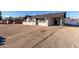 Front view of house with driveway and rock landscaping at 3540 W Monterey Way, Phoenix, AZ 85019