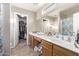Bathroom with double vanity and a walk-in closet at 3630 N French Pl, Casa Grande, AZ 85122