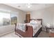 Cozy bedroom with wooden sleigh bed and window seat at 3630 N French Pl, Casa Grande, AZ 85122