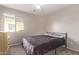 Simple bedroom with metal frame bed and neutral decor at 3630 N French Pl, Casa Grande, AZ 85122