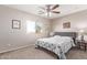 Bedroom with a queen-size bed and neutral decor at 3630 N French Pl, Casa Grande, AZ 85122