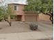 Two-story house with a two-car garage and desert landscaping at 3630 N French Pl, Casa Grande, AZ 85122