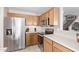 Kitchen with stainless steel appliances and wooden cabinets at 3630 N French Pl, Casa Grande, AZ 85122