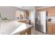 Kitchen with stainless steel appliances and wooden cabinets at 3630 N French Pl, Casa Grande, AZ 85122