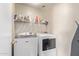 Laundry room with washer, dryer, and shelving at 3630 N French Pl, Casa Grande, AZ 85122