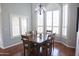 Formal dining area with hardwood floors and large window at 4251 W Jasper Dr, Chandler, AZ 85226