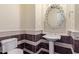 Elegant powder room with pedestal sink and mosaic tile at 4599 N Village Pkwy, Litchfield Park, AZ 85340