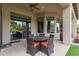 Covered patio with seating area and view of pool at 4599 N Village Pkwy, Litchfield Park, AZ 85340