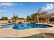 Luxury pool and spa with rock waterfall feature at 4599 N Village Pkwy, Litchfield Park, AZ 85340