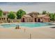 Inviting community pool with a large sundeck at 4728 E Waterman St # 101, Gilbert, AZ 85297