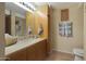 Bathroom with single sink, granite countertop and large mirror at 4808 N 24Th St # 621, Phoenix, AZ 85016