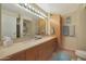 Bathroom with double sinks, granite countertop and large mirror at 4808 N 24Th St # 621, Phoenix, AZ 85016
