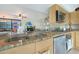 Modern kitchen with granite countertops and stainless steel appliances at 4808 N 24Th St # 621, Phoenix, AZ 85016