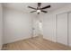 Bedroom with ceiling fan and access to hallway at 499 S Washington St, Chandler, AZ 85225