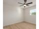 Spacious bedroom with ceiling fan and hardwood floors at 499 S Washington St, Chandler, AZ 85225