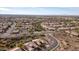 Aerial view of a golf course community with a variety of homes and landscaping at 5217 S Crested Saguaro Ln, Gold Canyon, AZ 85118