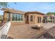 Paved back patio with a fire pit and grill area next to desert landscaping at 5217 S Crested Saguaro Ln, Gold Canyon, AZ 85118