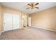 Bedroom with double doors to the closet and plush carpeting at 5217 S Crested Saguaro Ln, Gold Canyon, AZ 85118
