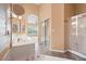 Main bathroom with dual vanities, a large soaking tub, and a separate shower at 5217 S Crested Saguaro Ln, Gold Canyon, AZ 85118