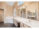 Main bathroom featuring dual vanities, a soaking tub, and separate shower at 5217 S Crested Saguaro Ln, Gold Canyon, AZ 85118