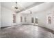 Sunroom with tile floor, ceiling fans, and access to a balcony at 5217 S Crested Saguaro Ln, Gold Canyon, AZ 85118
