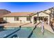 Home exterior showcasing a private pool and spacious backyard at 5415 W Novak Way, Laveen, AZ 85339