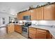 Eat-in kitchen featuring ample cabinetry and tile flooring at 6354 S Sinova Ave, Gilbert, AZ 85298