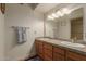 Double vanity bathroom with granite countertop and glass sink at 8651 E Royal Palm Rd # 105, Scottsdale, AZ 85258