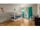 Bedroom with bunk beds and teal curtains at 8651 E Royal Palm Rd # 105, Scottsdale, AZ 85258