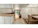 Open dining area with wood table and view of the living room at 8651 E Royal Palm Rd # 105, Scottsdale, AZ 85258