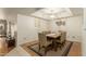 Dining area features a wood table, chairs and area rug at 8651 E Royal Palm Rd # 105, Scottsdale, AZ 85258