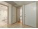 Bright entryway with tile flooring, bathroom access, and doors to bedrooms at 8651 E Royal Palm Rd # 105, Scottsdale, AZ 85258