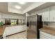 Kitchen boasts stainless steel refrigerator and ample cabinet space at 8651 E Royal Palm Rd # 105, Scottsdale, AZ 85258