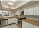 Kitchen with stainless steel appliances and granite countertops at 8651 E Royal Palm Rd # 105, Scottsdale, AZ 85258