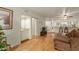 Living area with a wet bar and view into kitchen at 8651 E Royal Palm Rd # 105, Scottsdale, AZ 85258