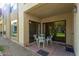 Small patio with table and chairs, adjacent to building exterior at 8651 E Royal Palm Rd # 105, Scottsdale, AZ 85258