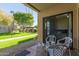 Private patio with seating area, partial view of backyard, and access to the interior at 8651 E Royal Palm Rd # 105, Scottsdale, AZ 85258