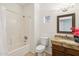 Bathroom with tub, toilet and granite vanity at 9100 E Raintree Dr # 130, Scottsdale, AZ 85260