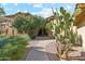 Landscaped pathway with desert plants and building view at 9100 E Raintree Dr # 130, Scottsdale, AZ 85260