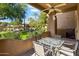 Private patio with table and chairs, overlooking the community at 9100 E Raintree Dr # 130, Scottsdale, AZ 85260