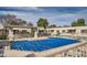 Community pool with blue cover and lounge chairs at 9277 W Jason Dr, Peoria, AZ 85382