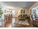 Combined living and dining area with hardwood floors at 10104 W Forrester Dr, Sun City, AZ 85351