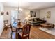 Living room features wood floors and comfortable seating at 10104 W Forrester Dr, Sun City, AZ 85351